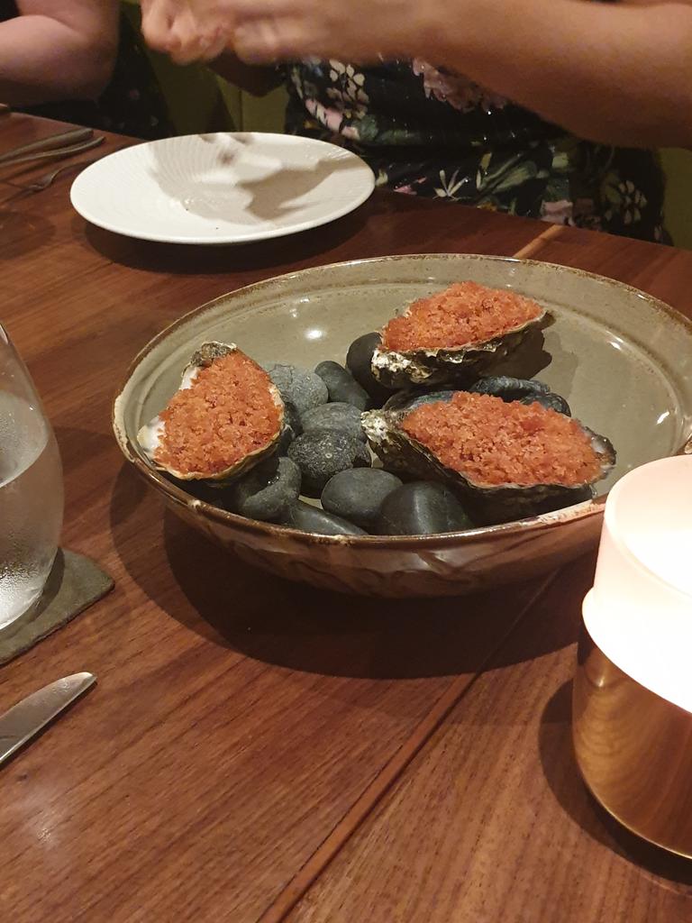 Oysters with slushy smoked tomato ice take the edge of a sticky Singapore evening.