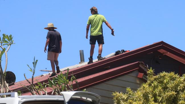 Volunteers have also been assisting in repairing damaged roofs after the widespread devastation. Picture: NCA NewsWire / Scott Powick