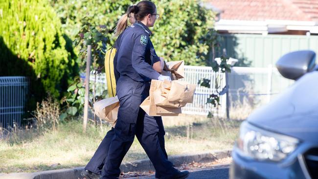 Police take evidence from the scene. Picture: Brett Hartwig