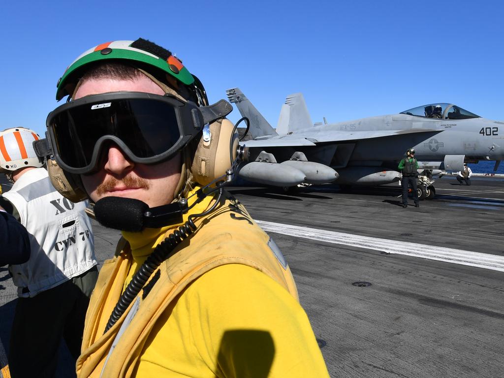 Crew are seen preparing a F/A-18E Super Hornet for take off. Picture: AAP Image/Darren England