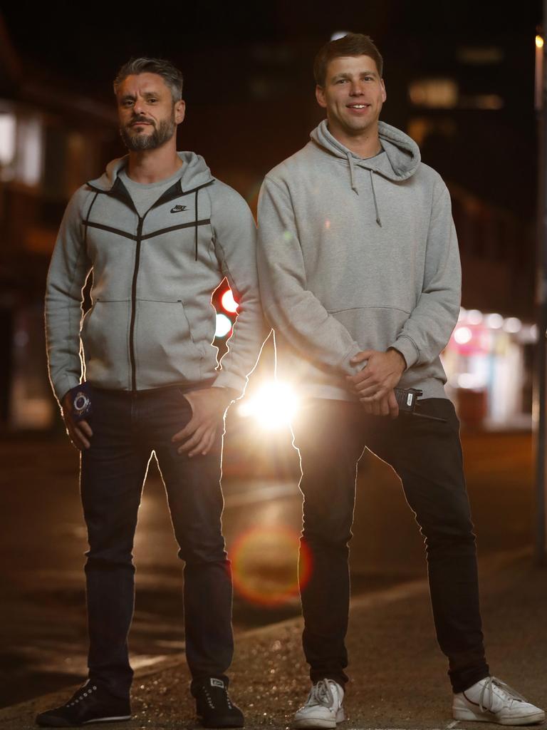 Detective Sergeant Matthew Crematy (left) and Senior Constable Simon Pollack from the Redfern Region Enforcement Squad (RES) after an operation, Strike Force Northrop to find dial-a-dealers in Sydney. In total, police seized $12,130 cash, 38g of cocaine, 4.2g of ketamine, 4.9g of MDMA and a knife. The combined estimated potential street value of the prohibited drugs seized is nearly $21,000. Picture: Jonathan Ng