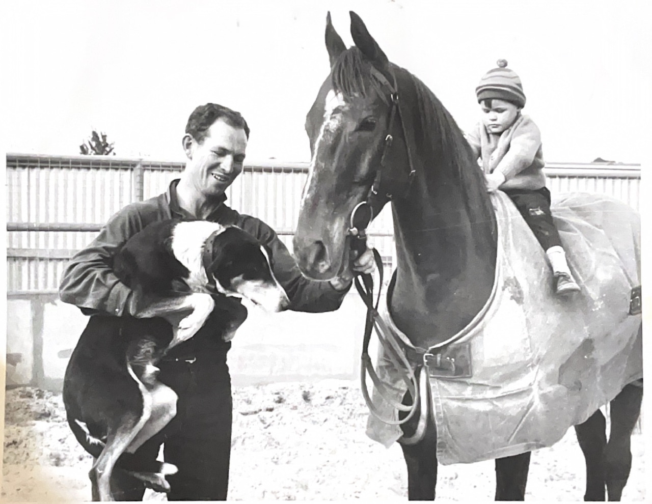 John Hall (left) holding Melbourne Cup winner Red Handed, with son Barney aboard. Picture: Supplied