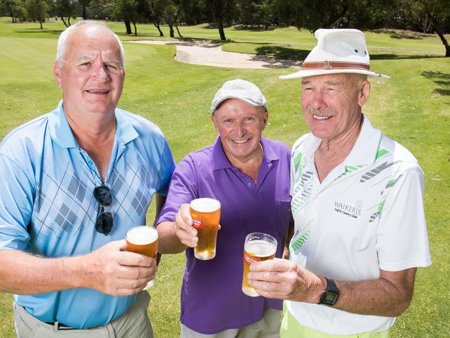 Willunga golfers George Meyer, Ian Tuck, and Larry lodge, raise a $6 beer after a game of golf. Picture: Matt Loxton