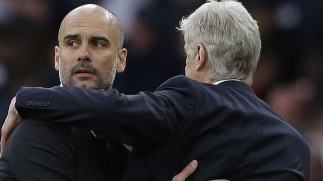 Manchester City manager Pep Guardiola, left, with Arsenal team manager Arsene Wenger.