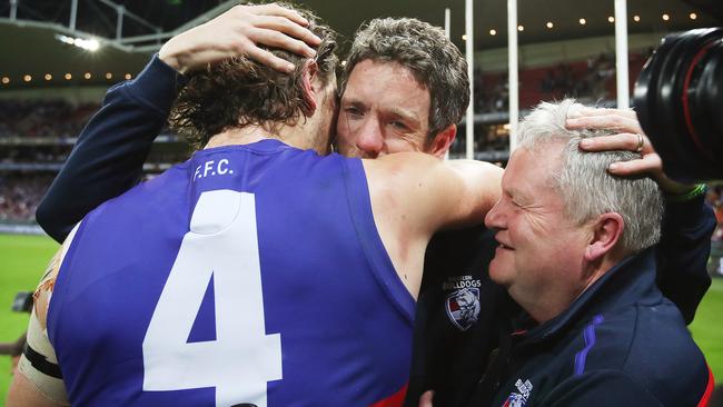 Marcus Bontempelli, Bob Murphy and Peter Gordon celebrate the preliminary final win. Picture: Phil Hillyard