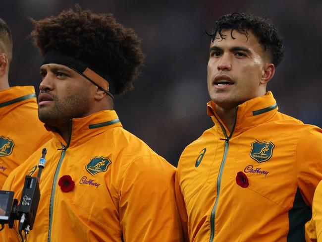 Australia's centre Joseph-Aukuso Suaalii (C) sings their National Anthem in the line-up ahead of kick-off in the Autumn Nations Series International rugby union test match between England and Australia at the Allianz Stadium, Twickenham in south-west London, on November 9, 2024. (Photo by Adrian Dennis / AFP)