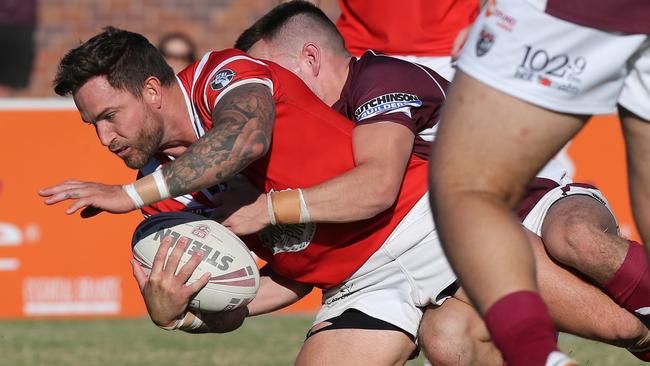 Currumbin Eagles Daniel Webb being tackled during a game in 2018. Picture Glenn Hampson