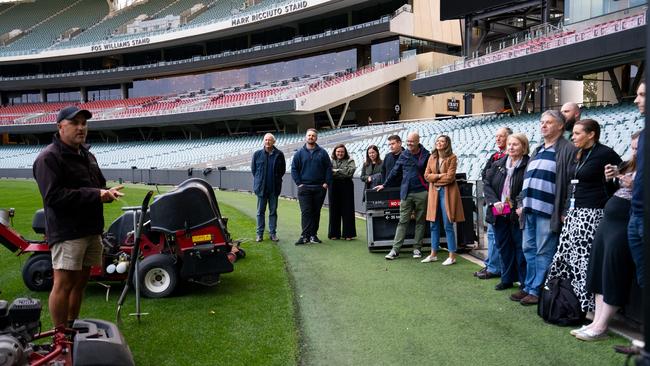 Adelaide Oval employees learning from the best, with lawn tips by Head Curator Damian Hough.