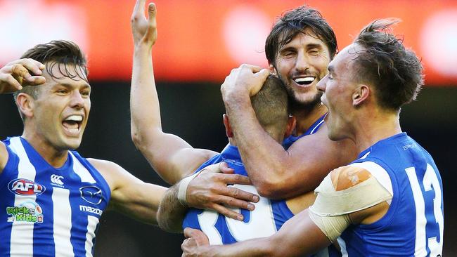 Shaun Higgins, Jarrad Waite and Ryan Clarke mob Billy Hartung after a goal. Picture: Getty Images