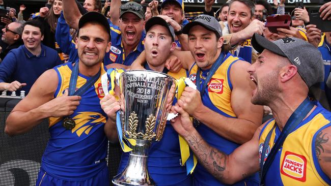 (from left) Dom Sheed, Jeremy McGovern, Tom Barrass and Chris Masten celebrate their Grand Final win. Picture: Phil Hillyard