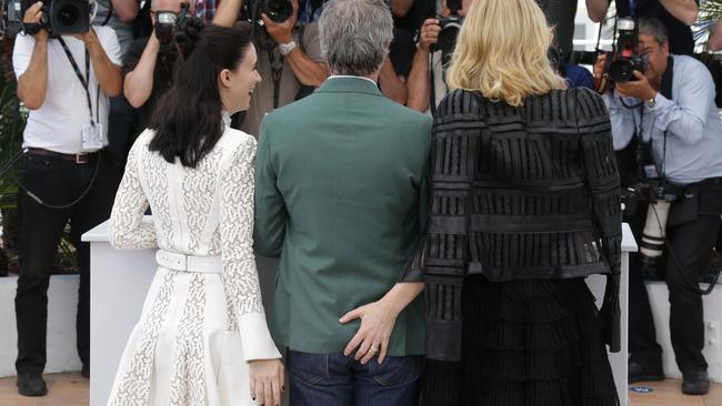 (From L) US actress Rooney Mara and Australian actress Cate Blanchett joke around by grabbing US director Todd Haynes’ behind.