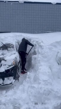 Bills players have to dig out their cars as they arrive back to find them  submerged in snow