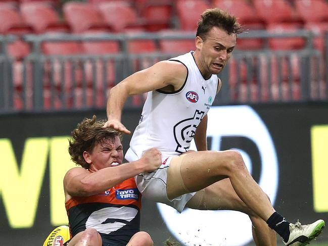 Hamilton lays a tackle against Carlton.
