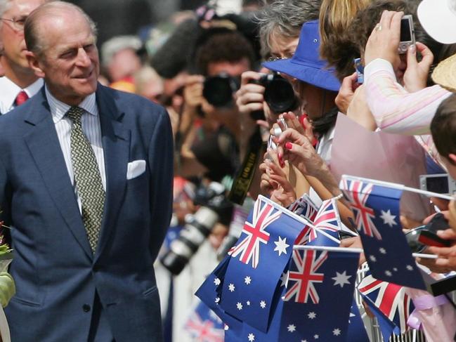 SYDNEY, AUSTRALIA - MARCH 13: Her Majesty Queen Elizabeth II and His Royal Highness Prince Philip, the Duke of Edinburgh greet members of the public at the Sydney Opera House March 13, 2006 in Sydney, Australia. The Queen and Prince Philip are on a five-day visit to Australia where she will officially open the Commonwealth Games in Melbourne.    (Photo by Matt King/Getty Images)