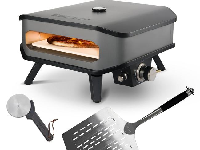 Cozze 13” gas pizza oven with stainless steel paddle and cutter.