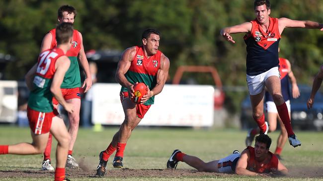 Peninsula FL: Pines v Mt Eliza. Pines #31 Chris Smith looks to clear the ball from the centre. Picture: Jason Sammon Saturday 9 April 2016