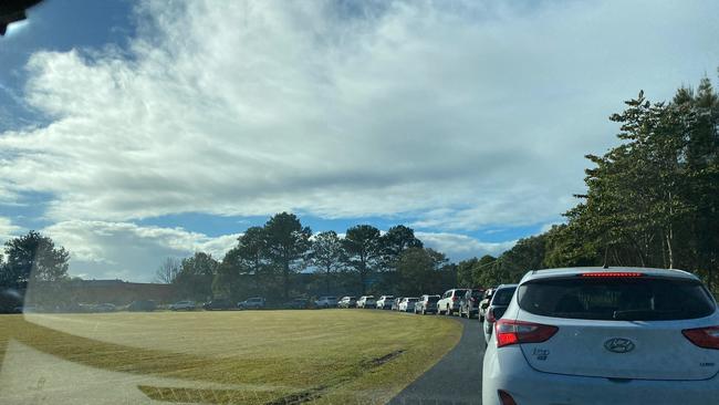 Long lines of cars are snaking their way around the Cavanabah Centre at Byron Bay.