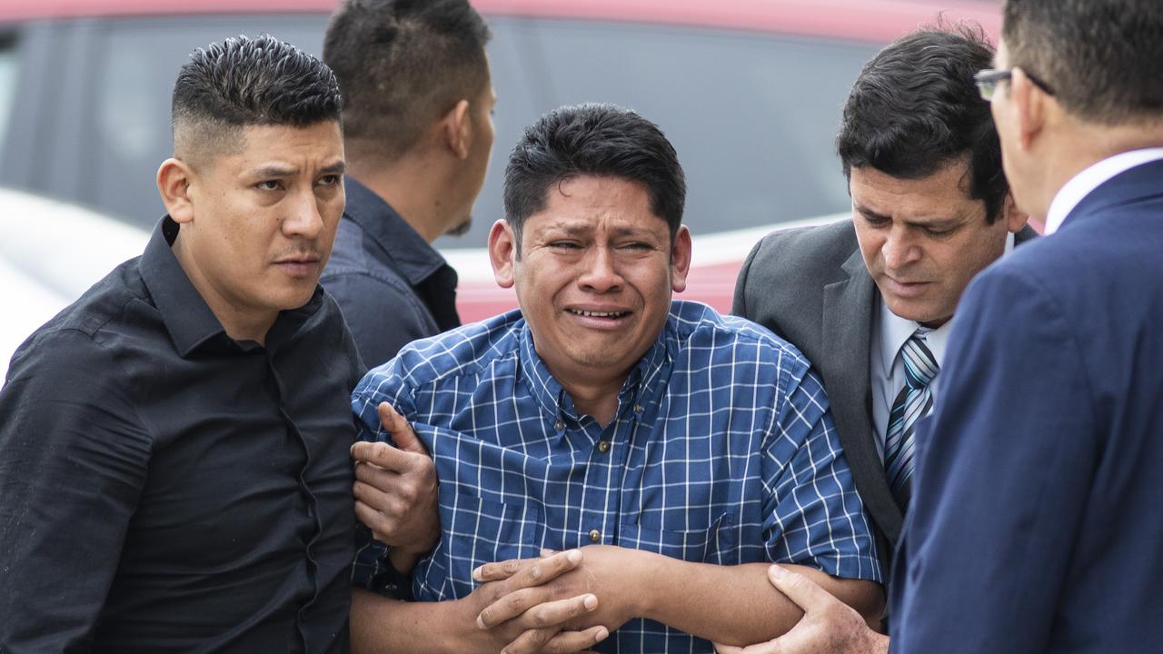 Arnulfo Ochoa, the father of Ms Ochoa-Lopez, is surrounded by family members and supporters as he walks into the Cook County medical examiner's office to identify his daughter's body. Picture: Ashlee Rezin/Chicago Sun-Times via AP