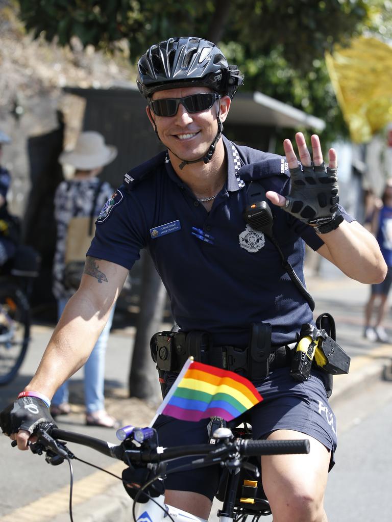 A police officer patrols on a bicycle during the Pride Festival Rally in Brisbane in 2017.