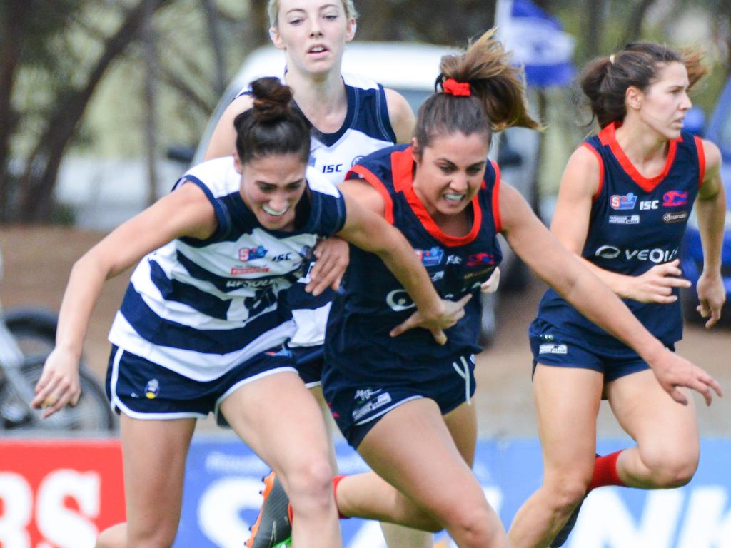 South Adelaide v Norwood SANFLW game at Noarlunga, Saturday, April 20, 2019. Souths Cheyenne Hammond and Norwood's Jessica Macolino battle for the ball. (AAP Image/Brenton Edwards)