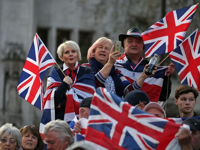 TOPSHOT - Pro-Brexit supporters holding Union flags attend a rally in central London on March 29, 2019, organised by Leave Means Leave. - British MPs on Friday rejected Prime Minister Theresa May's EU divorce deal for a third time, opening the way for a long delay to Brexit -- or a potentially catastophic "no deal" withdrawal in two weeks. (Photo by Daniel LEAL-OLIVAS / AFP)