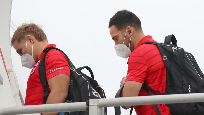 Dragons stars Jack de Belin and Corey Norman board one of the Virgin planes.