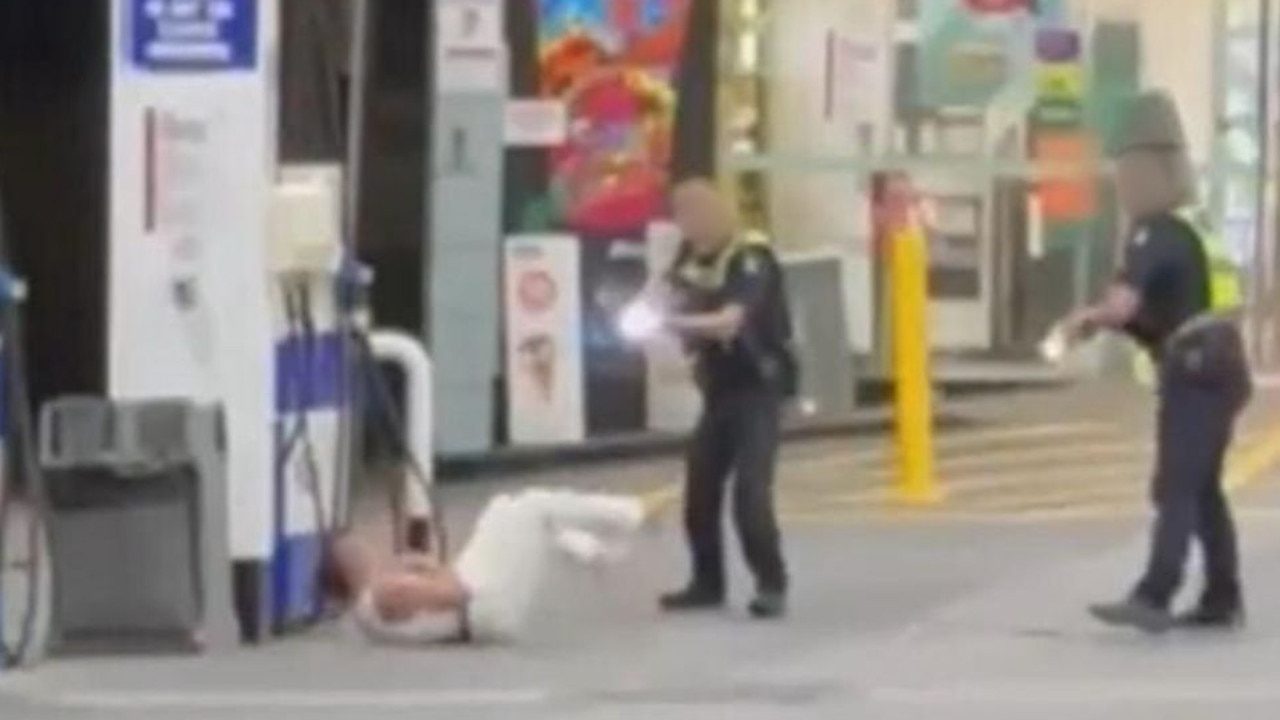 Moment cop kicks and tasers woman