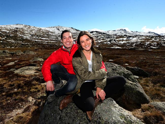 Tyson Dale and Lauren Hunziker from Los Angeles in USA stop at a lookout on their way to the summit of Mt Kosciuszko.