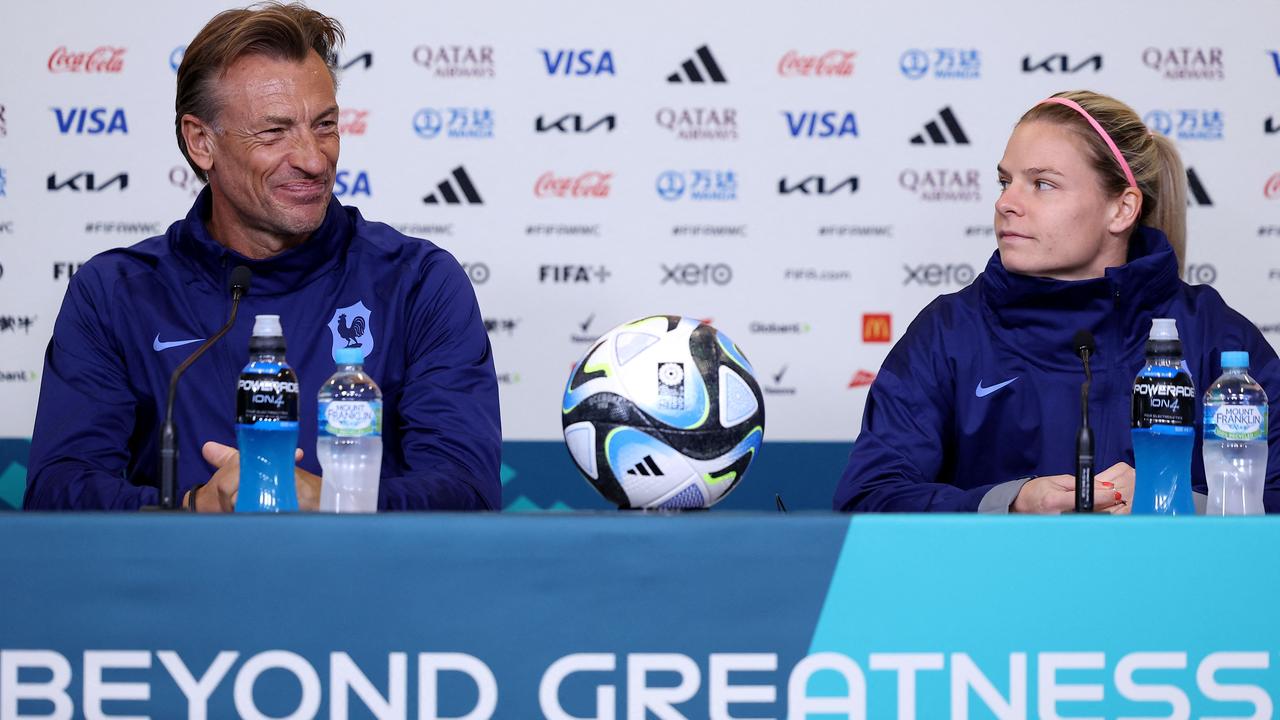 France's head coach Herve Renard (L) and France's forward Eugenie Le Sommer.