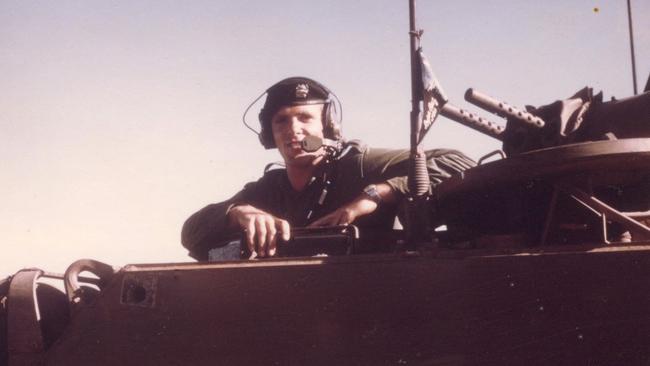 Robert Asquith as a troop carrier driver in Vietnam. Look closely on the radio antenna and you can see the Byron Bay flag he flew the whole time he was in Vietnam. Picture: Supplied/Rob Asquith