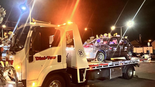 A grey Mazda Astina – decked out with Christmas lights and large ornaments – was spotted driving on the footpath at busy Henley Square. Picture: SA Police