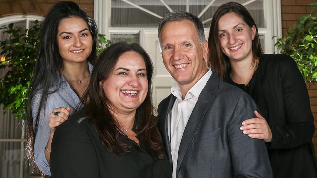 Jim Dolkas, with wife Faye and daughters Eleni and Anastasia, fits in Australia’s most optimistic demographic. Picture: Tim Carrafa