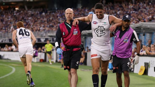 Marc Pittonet had to be assisted from the field after injuring his left knee against the Dockers. Picture: Getty Images.