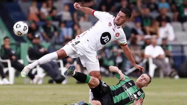 Western Sydney’s Dylan McGowan is tackled by Western United’s Besart Berisha