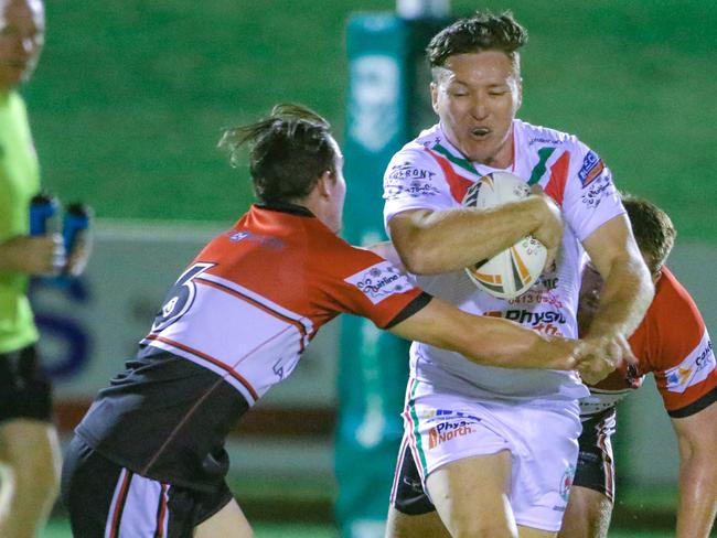 Robbie Butcher carrying the ball for Nightcliff Dragons against Litchfield Bears. Picture: Glenn Campbell