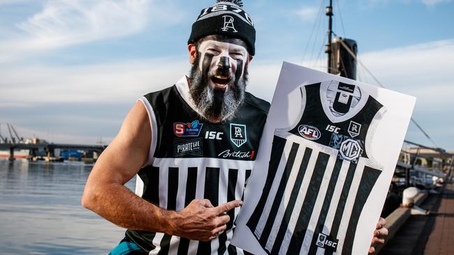 Myles 'Tealheart' Neal with his Port Adelaide Prison Bar Guernsey at Port Adelaide. Picture Matt Turner.