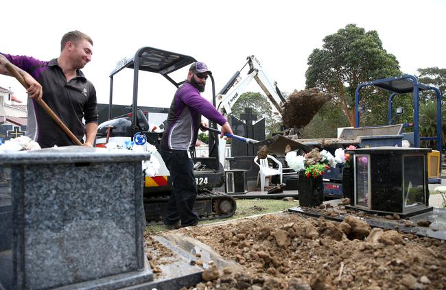 Rookwood Cemetery conducted 2001 interments in 2016-17. Pictured are grave diggers at work. Picture: Justin Sanson