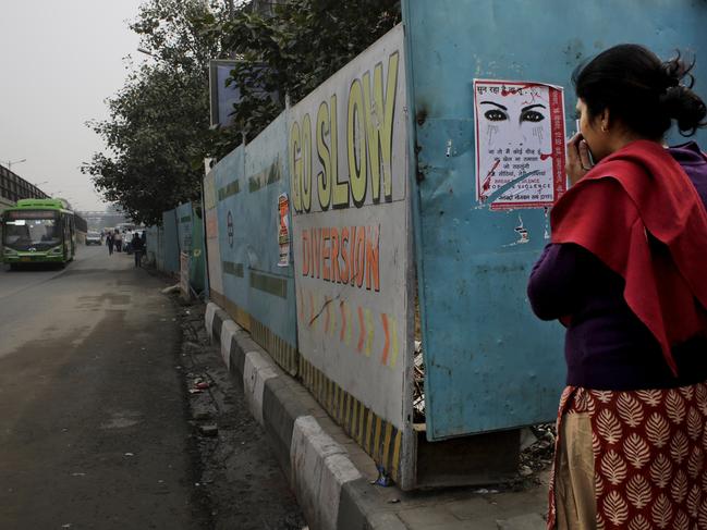 An Indian woman waits at a bus stop where the victim of a deadly gang rape in a moving bus had boarded the bus two years ago, in New Delhi, India, Tuesday, Dec. 16, 2014. The case sparked public outrage and helped make women’s safety a common topic of conversation in a country where rape is often viewed as a woman’s personal shame to bear. (AP Photo/Altaf Qadri)