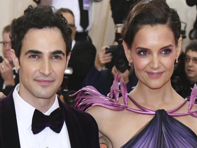 FILE - In this May 6, 2019, file photo, designer Zac Posen, left, and Katie Holmes attend The Metropolitan Museum of Art's Costume Institute benefit gala celebrating the opening of the "Camp: Notes on Fashion" exhibition in New York. Posen is shutting down his namesake label. Posen has been a red carpet favorite for close to two decades. Heâ€™s known for glamorous, body-hugging gowns, often with long trains or big, flamboyant ruffles, for stars like Holmes and Rihanna. (Photo by Charles Sykes/Invision/AP, File)