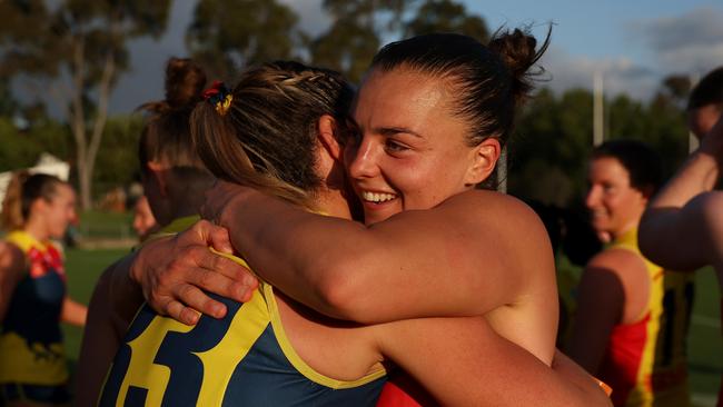 MELBOURNE, AUSTRALIA - OCTOBER 20: Ebony Marinoff of the Crows (R) hugs Anne Hatchard of the Crows after winning the round eight AFLW match between Collingwood Magpies and Adelaide Crows at Victoria Park, on October 20, 2024, in Melbourne, Australia. (Photo by Daniel Pockett/Getty Images)