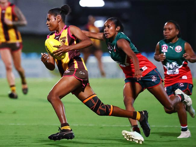 Hawk's Lusa Wagia beats Cutters' Isa Matthew in a foot race in the AFL Cairns Women's preliminary final match between the Manunda Hawks and the South Cairns Cutters, held at Cazalys Stadium, Westcourt. Picture: Brendan Radke