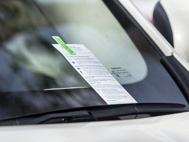 Parking data from across the city has shown a hot spot near Melbourne Zoo on Saturday afternoons. There were more than 6700 fines handed out in two carparks near the zoo in 2015/16. Illegally parked cars and parking inspectors booking illegally parkedd cars in and around carpark on POPLAR ROAD. Car with parking ticket after illegally parking on the nature Strip.