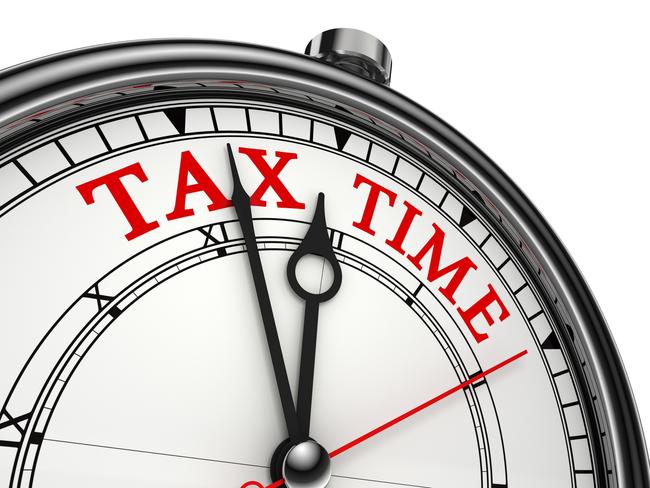 tax time concept clock closeup isolated on white background with red and black words.  tax clock, tax time countdown generic