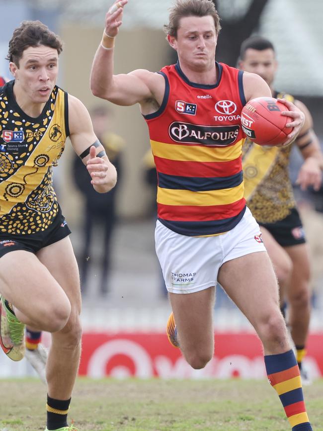 Matt Crouch drives Adelaide forward during his monster 41-disposal performance against Glenelg at the Bay. Picture: SANFL Image/David Mariuz