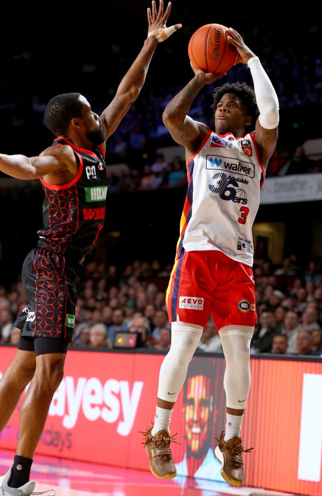 Bryce Cotton defends a three-point shot by Kendric Davis the last time the Wildcats and 36ers met. Picture: Kelly Barnes/Getty Images