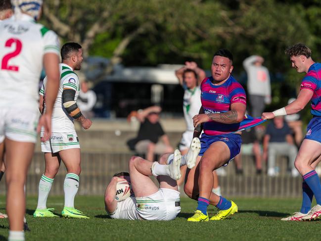 Jake Tobin crunched by Rovers enforcer Toesami Toevai. Picture: Adam Wrightson Photography