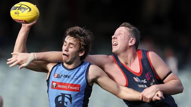 Sturt’s Daniel Fahey-Sparks and Norwood’s Sam Baulderstone battle in the ruck. The SANFL will align with the AFL’s third man up rule next season. Picture: Sarah Reed