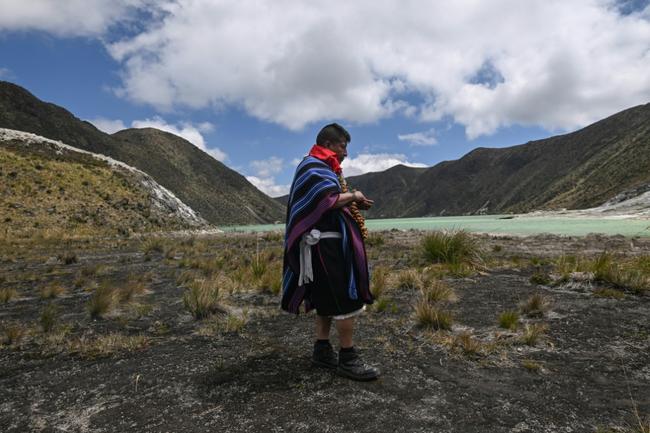 Before the two-hour ascension to the lake, a shaman performs a ritual in praise of the cycle of life