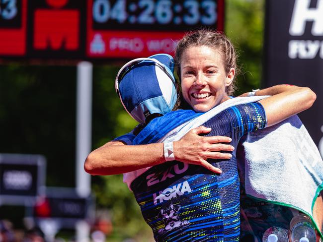 Ellie Salthouse embraces Grace Thek after she won the Ironman 70.3 Tasmania. Picture: Linda Higginson