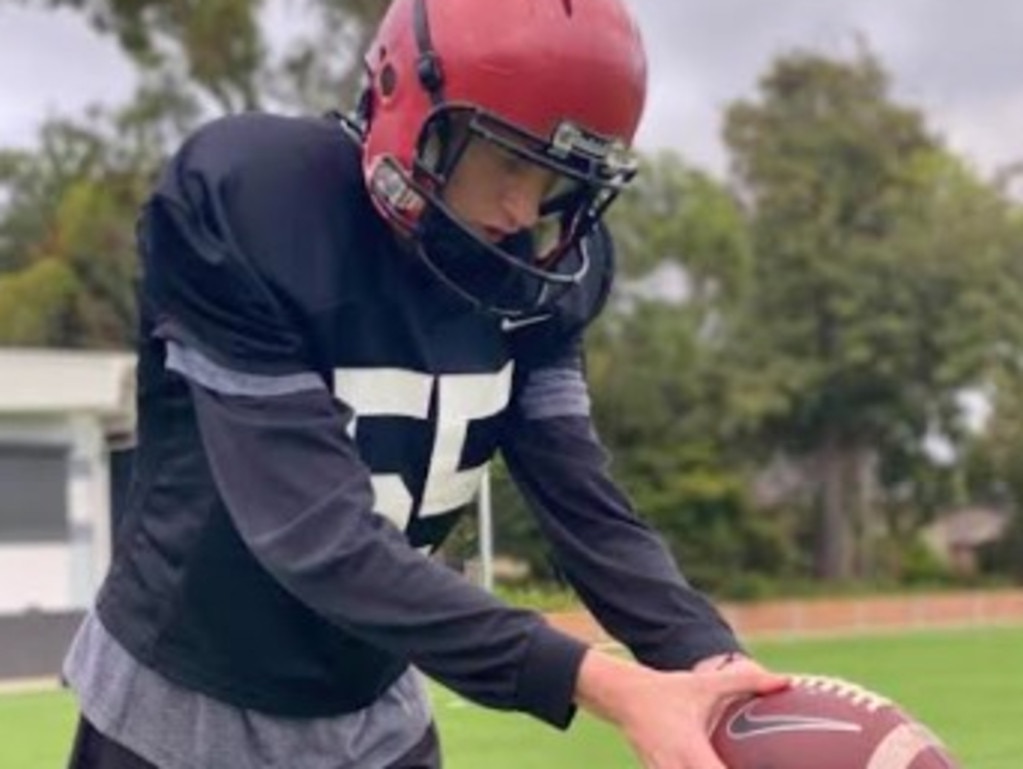 Max Fletcher learning the ropes of American football.